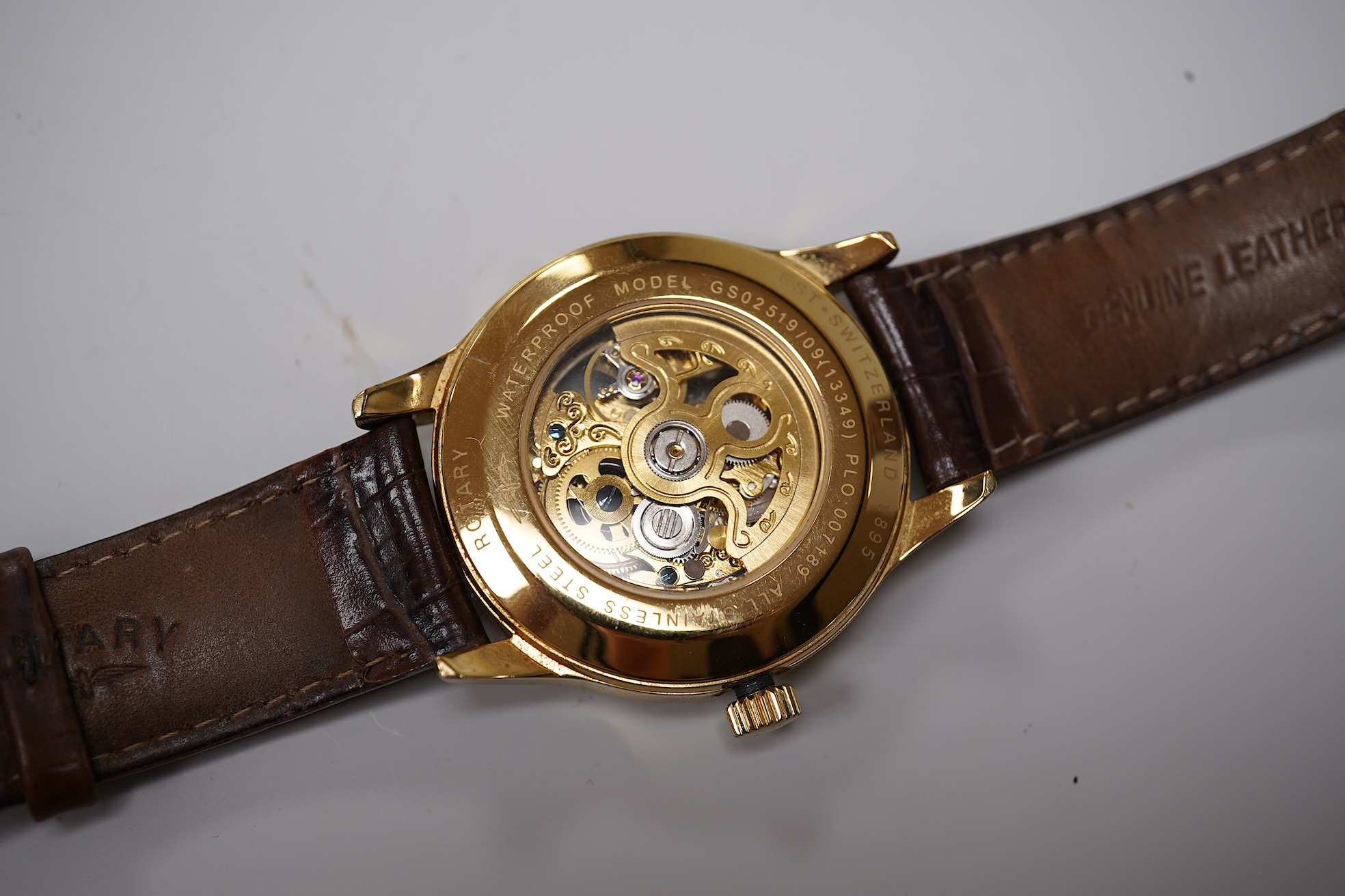 Four assorted gentleman's recent wrist watches including gilt stainless steel Rotary with visible escapement, Sekonda and Seiko.